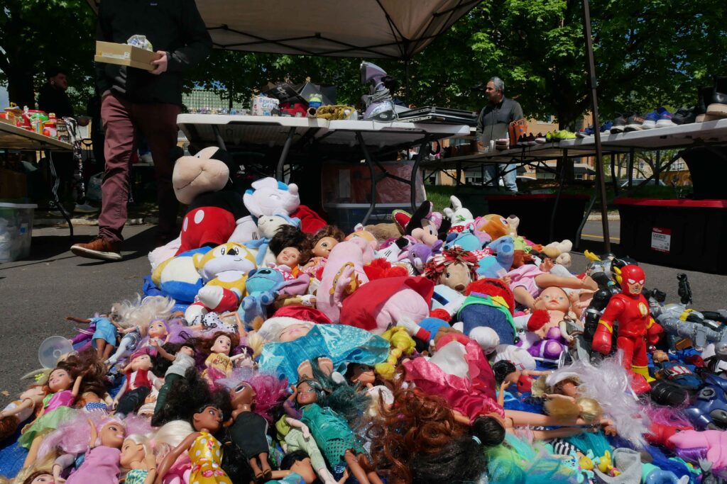 A blanket full of barbies, action figures, stuffed animals and other kids toys at the Skokie Park District flea market on May 2.